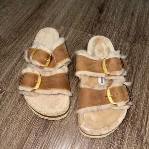 Birkenstock Tan Shearling Slippers with Gold Buckles